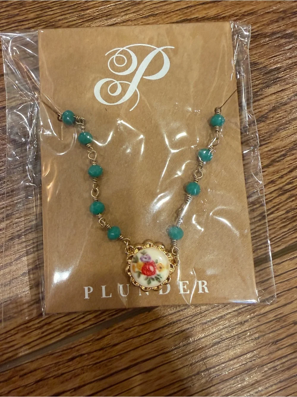 Plunder Teal Beaded Necklace with Floral Porcelain Medallion and Gold Accents